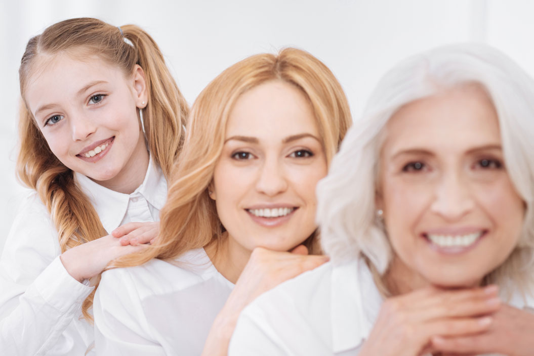 old woman, mother and daugther in white dresses